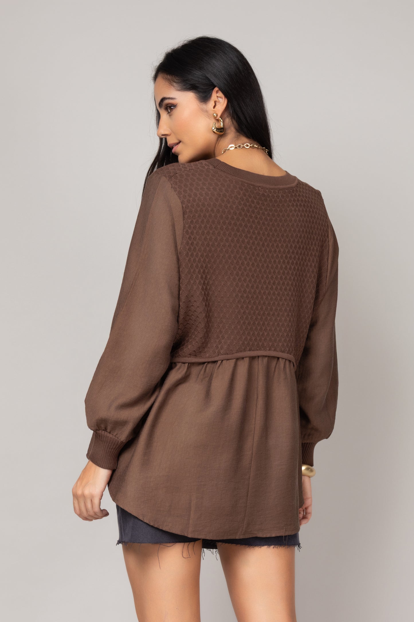 Blusa texturizada com mangas amplas