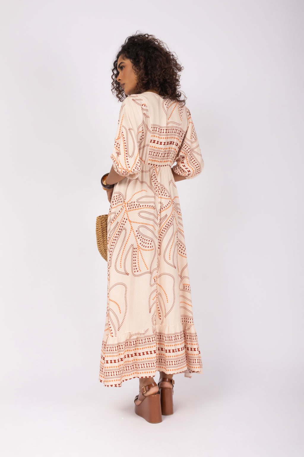 Vestido longo estampado com amarração no decote