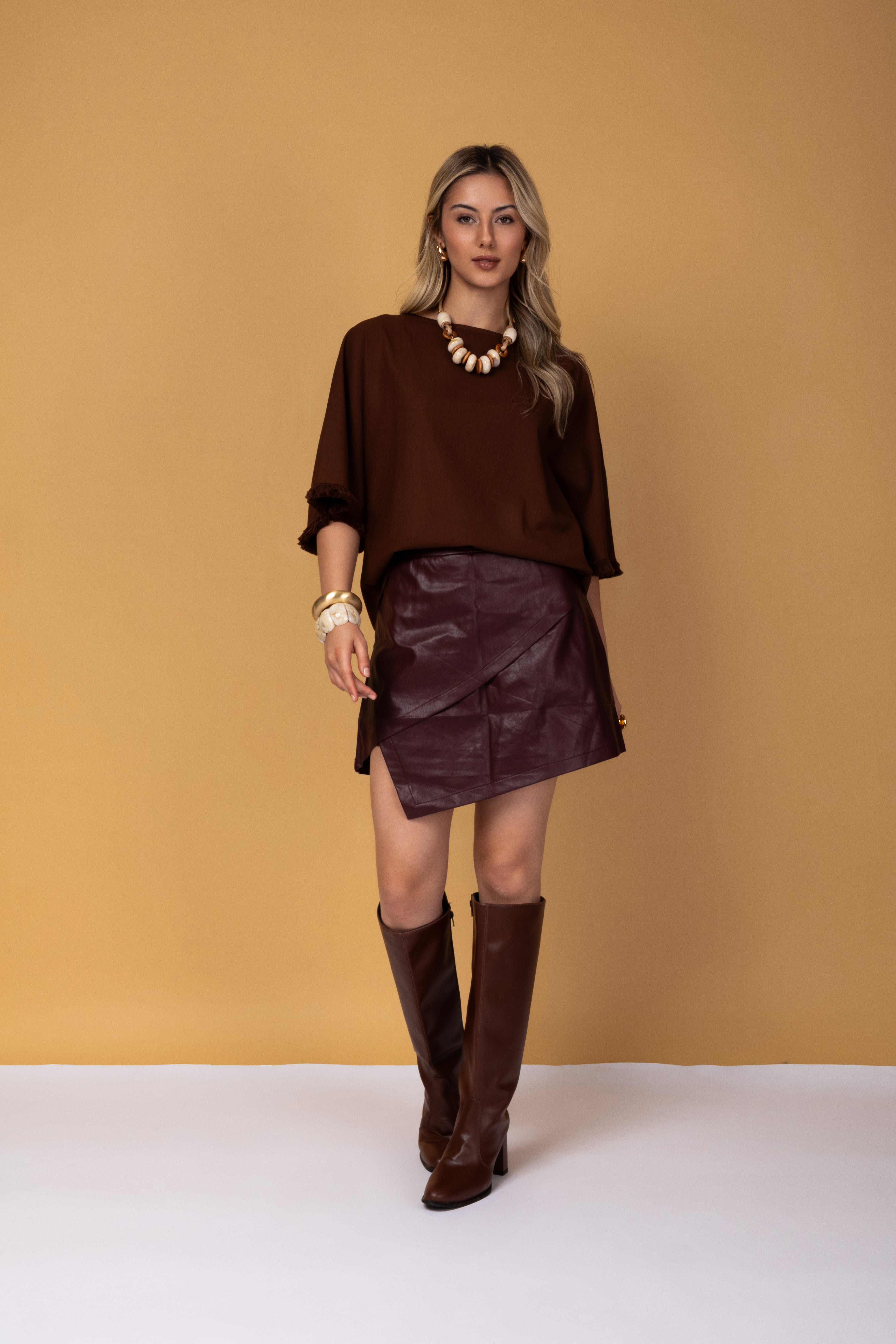 Blusa manga 3/4 e detalhes em franjas