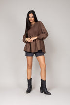 Blusa texturizada com mangas amplas