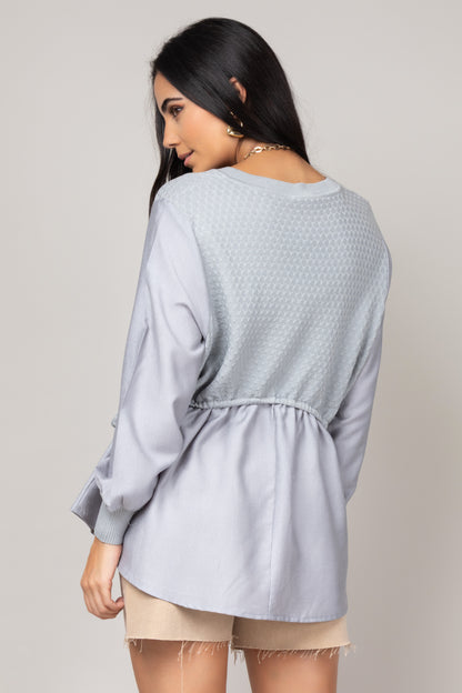 Blusa texturizada com mangas amplas