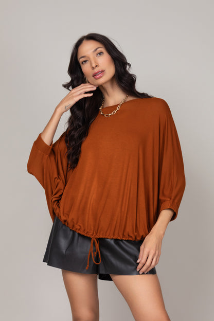 Blusa ampla com ajuste na barra