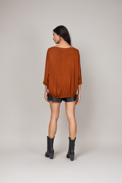 Blusa ampla com ajuste na barra