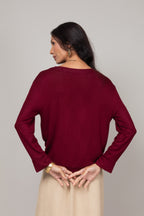 Blusa manga longa com nó frontal