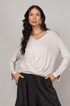 Blusa manga longa com nó frontal