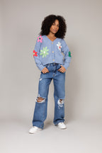 Cardigan de tricot floral