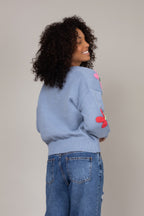 Cardigan de tricot floral